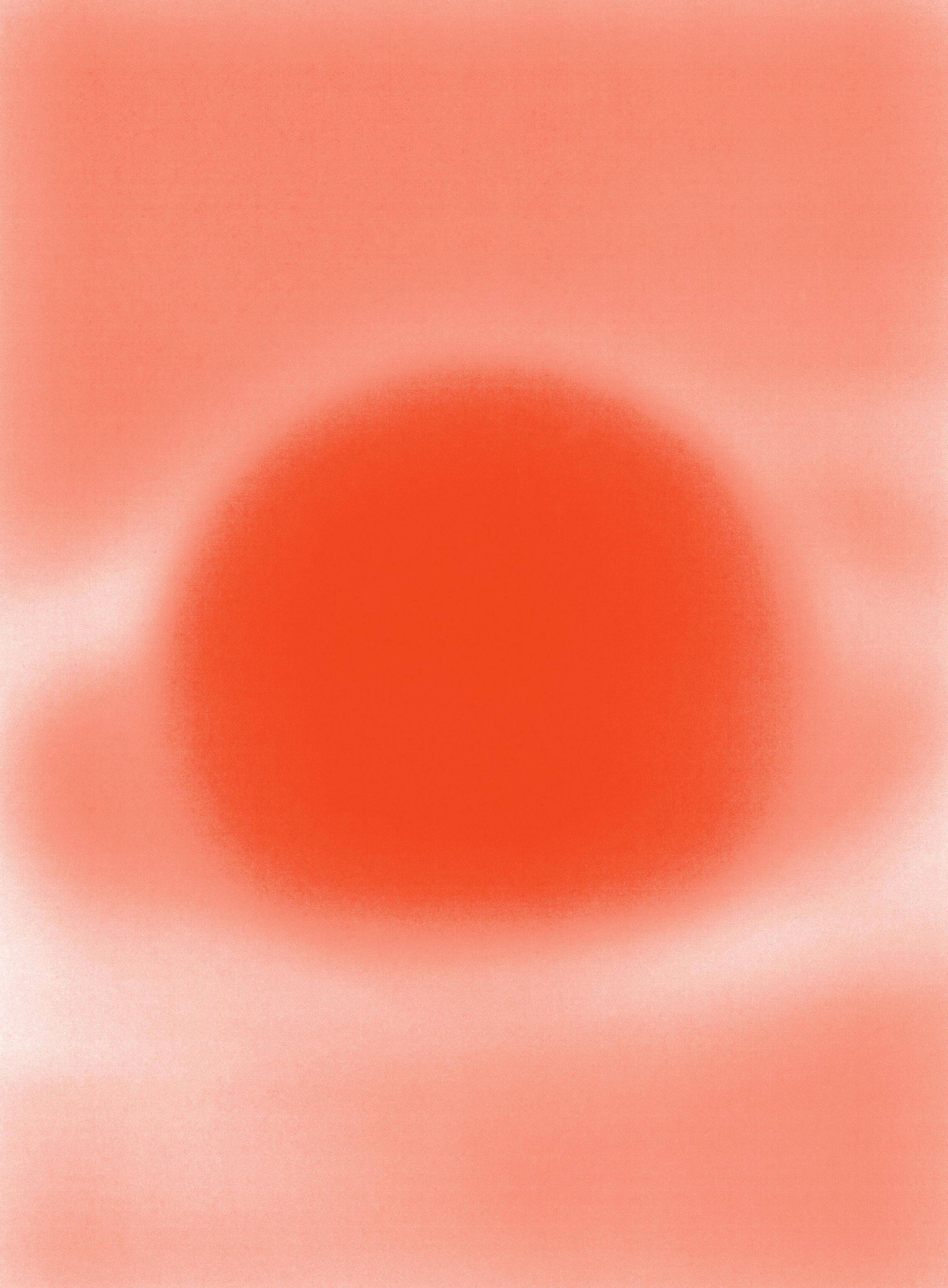 A blurred, abstract image featuring a large, soft-edged red circle in the center, surrounded by lighter red and white gradients. The overall effect resembles a glowing orb or sun against a hazy background.