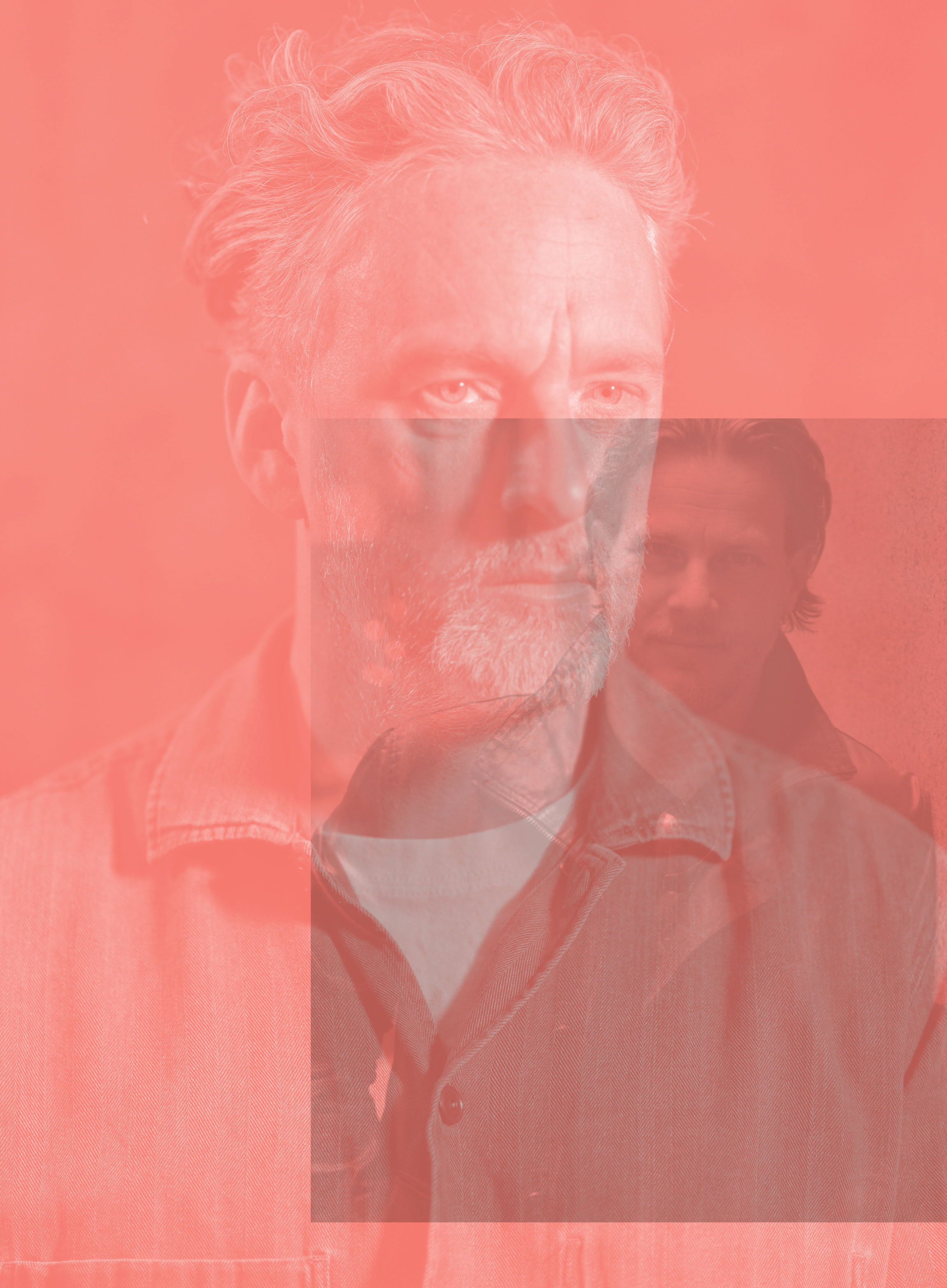 A portrait of a middle-aged man with gray hair and a beard, wearing a denim shirt, is overlaid with a translucent red filter and a faint, smaller image of a second man in the lower right.