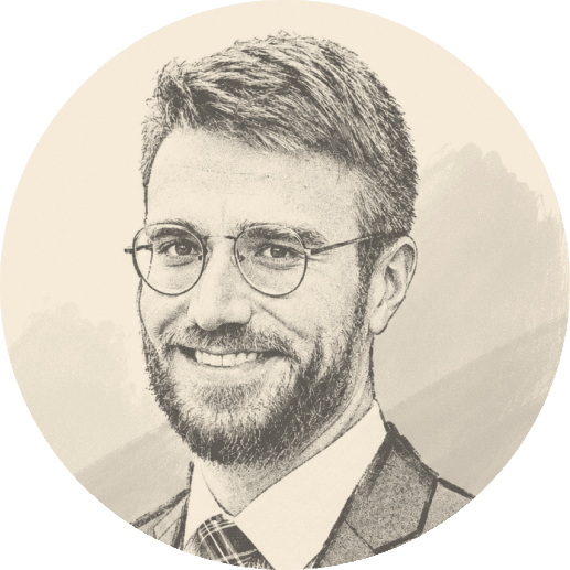 A man with short hair, a beard, and glasses is smiling. He is wearing a suit, dress shirt, and tie. The image has a sepia-tone, sketch-like effect with a plain background.